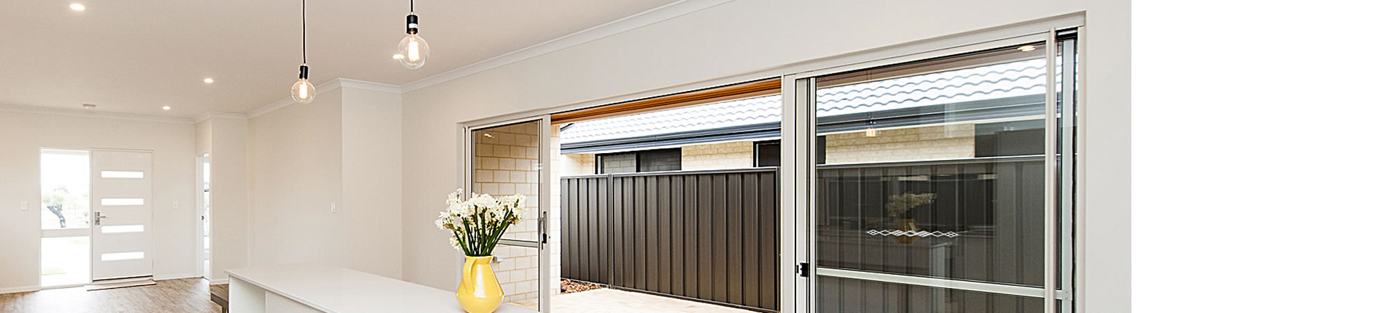 Interior living space with sliding doors opening to a courtyard